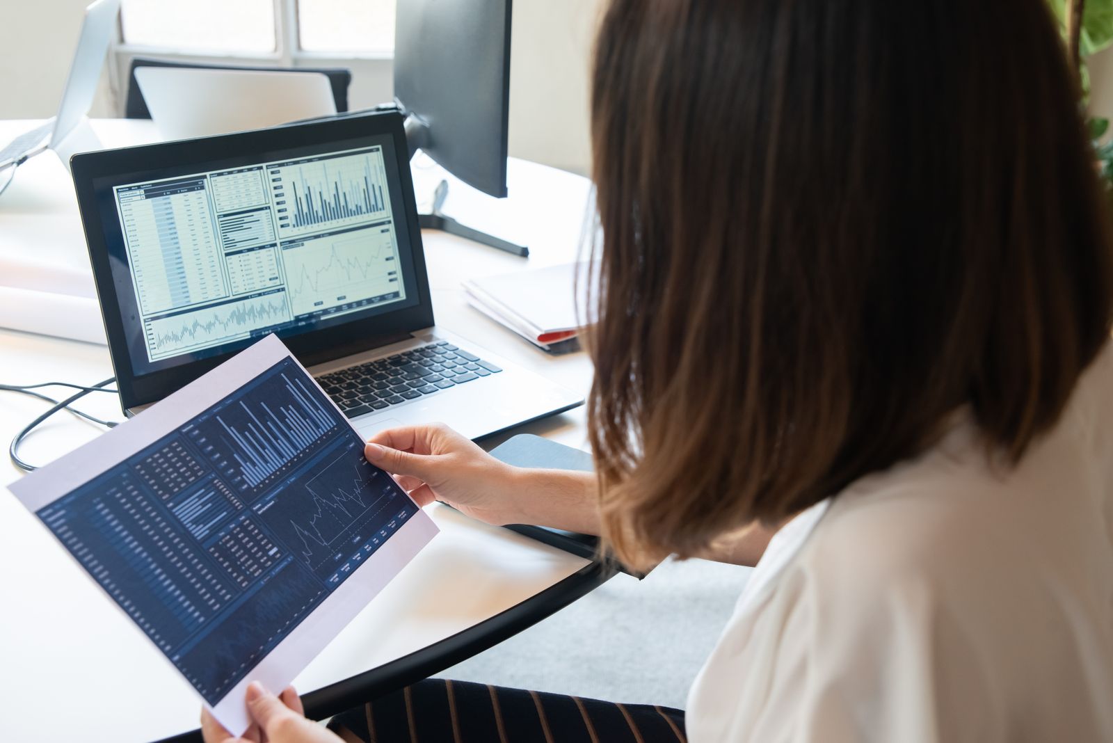 Researching construction data on a laptop